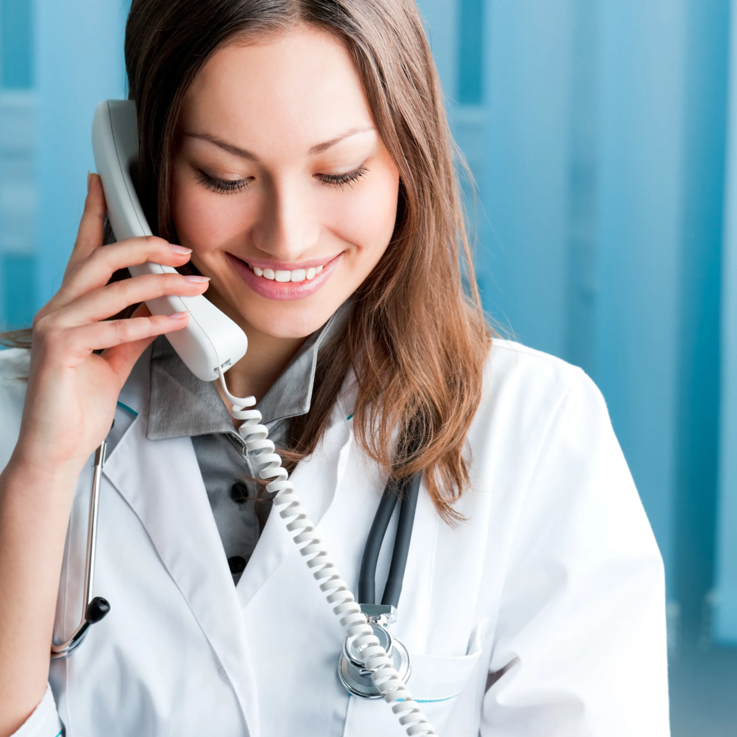 Portrait,Of,Happy,Smiling,Cheerful,Young,Female,Doctor,On,Phone,